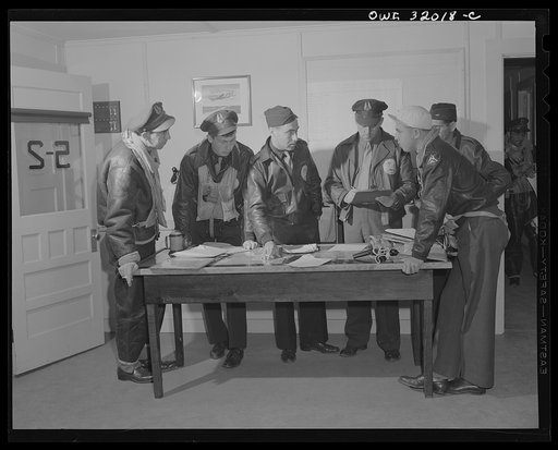Bar Harbor, Maine. Civil Air Patrol base headquarters of coastal patrol no. 20. Pilots and observers getting instruction before taking off on dawn patrol
