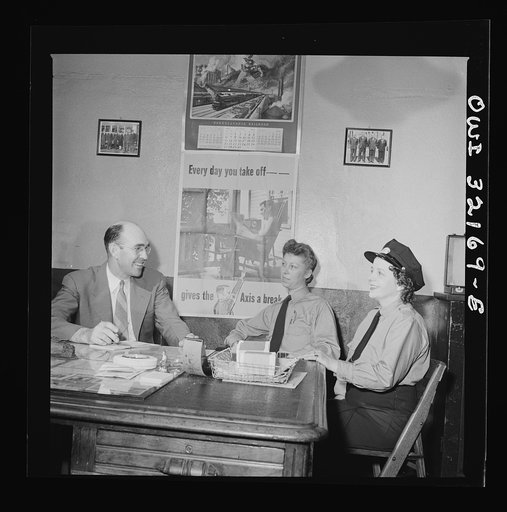 Washington, D.C. Women streetcar and bus operators Hattie B. Sheehan and Frances Lewis talking to Superintendent Henshaw of the Capitol Transit Company