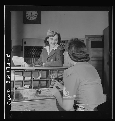 Washington, D.C. Miss Dorothy Lutz, a Western Union telegraph messenger, getting a sheaf of telegrams to deliver