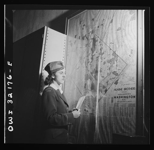 Washington, D.C. Miss Dorothy Lutz checking a map before she starts to deliver telegrams