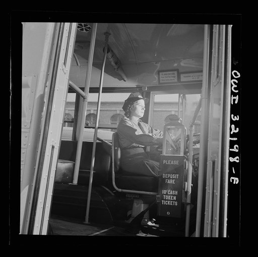 Untitled photo, possibly related to: Washington, D.C. An instructor of the Capitol Transit Company teaching a woman to operate a one-man streetcar