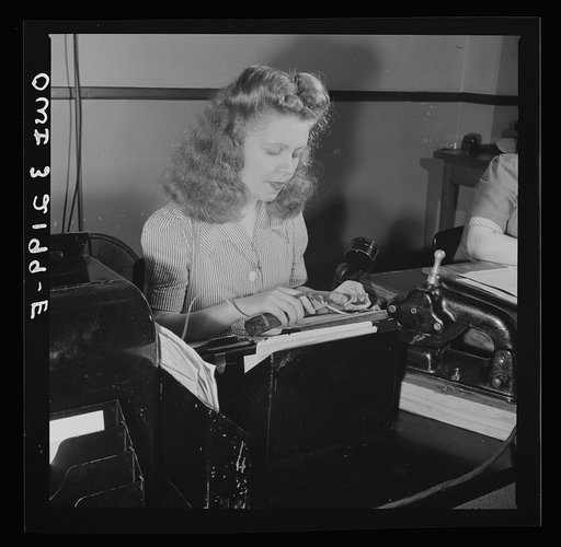 Washington, D.C. Miss Kathleen McCarthy, a Western Union teleprinter operator, receiving gumming telegraph messages