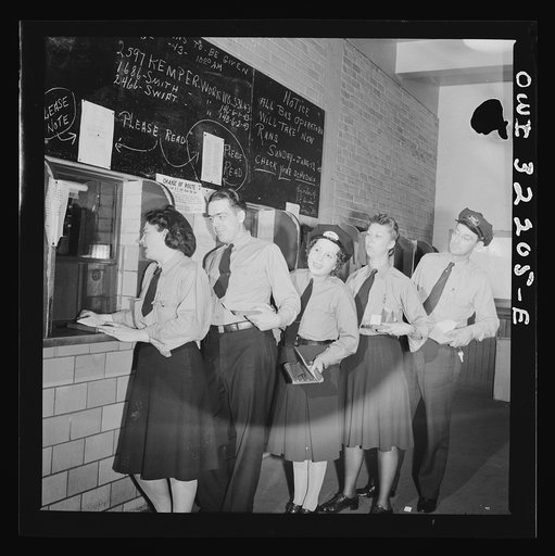Washington, D.C. Streetcar and bus operators of the Capitol Transit Company turning in their daily receipts to a receiver at the depot