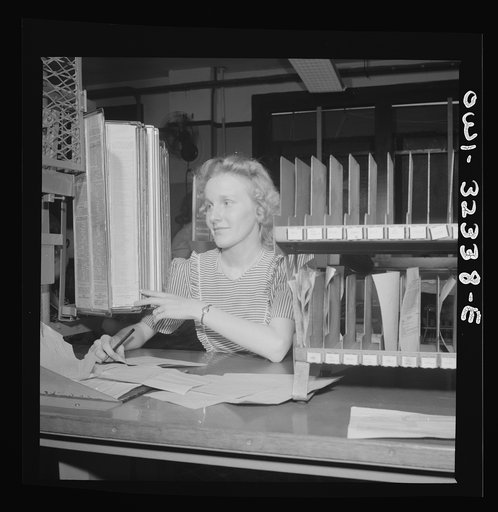 Washington, D.C. Miss Louis Crist working in the routing center at the Western Union telegraph office