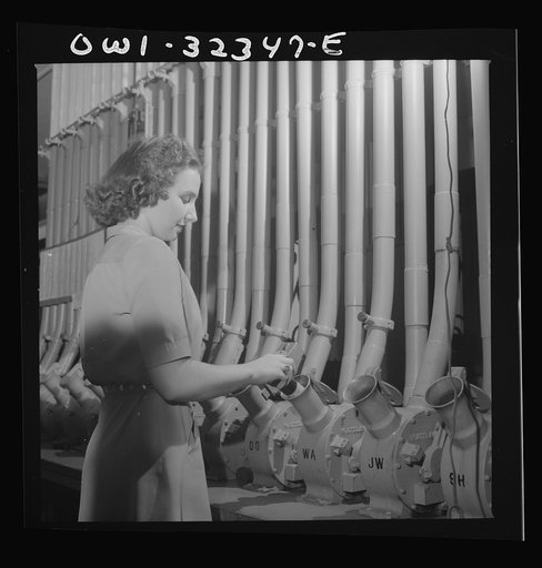 Washington, D.C. Miss Helen Ringwald works with the pneumatic tubes through which messages are sent to branches in other parts of the city for delivery