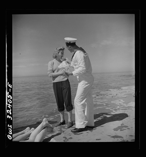 Untitled photo, possibly related to: Oswego, New York. United Nations heroes with their hostesses by Lake Ontario, at a swimming party held for visitors' entertainment during United Nations week