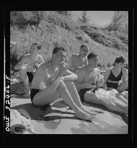 Oswego, New York. United Nations heroes eating a picnic lunch after swimming in Lake Ontario at a swimming party held for visitors' entertainment during United Nations week
