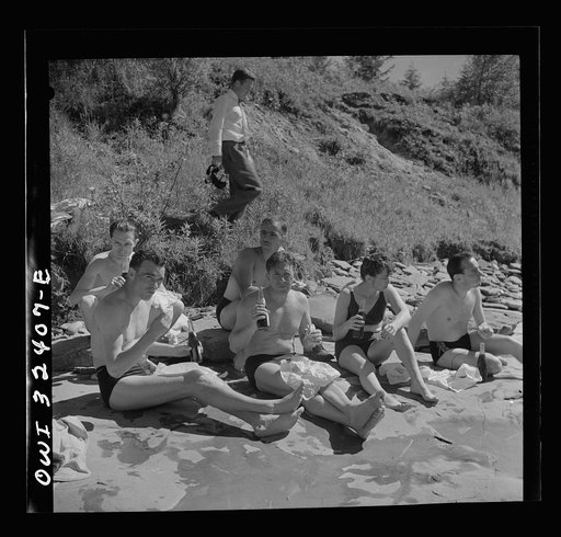 Untitled photo, possibly related to: Oswego, New York. United Nations heroes eating a picnic lunch after swimming in Lake Ontario at a swimming party held for visitors' entertainment during United Nations week