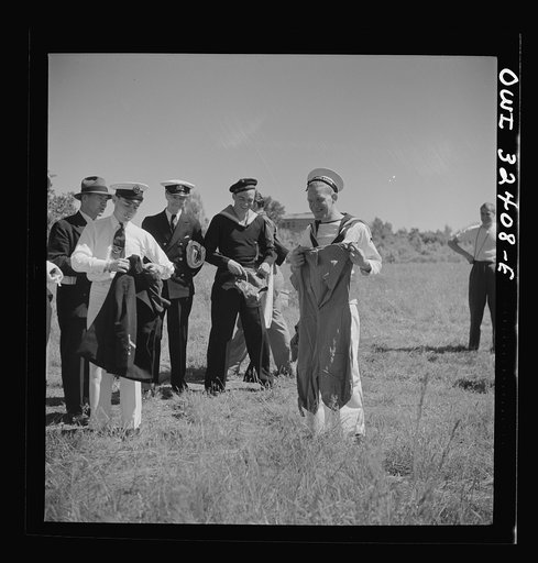 Oswego, New York. United Nations heroes taking their pick of bathing suits loaned by the townspeople for a swimming party held for visitors' entertainment during United Nations week