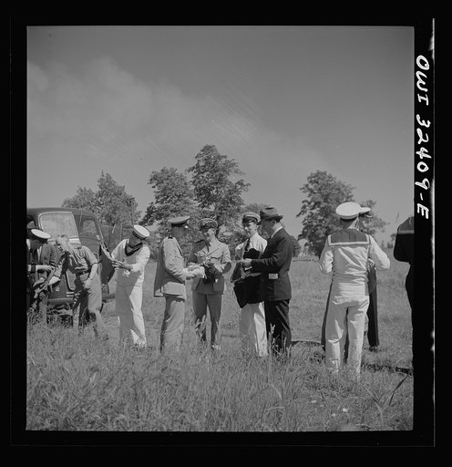 Untitled photo, possibly related to: Oswego, New York. United Nations heroes taking their pick of bathing suits loaned by the townspeople for a swimming party held for visitors' entertainment during United Nations week