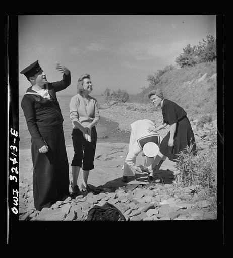 Untitled photo, possibly related to: Oswego, New York. United Nations heroes with their hostesses by Lake Ontario, at a swimming party held for visitors' entertainment during United Nations week