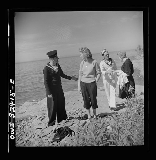 Untitled photo, possibly related to: Oswego, New York. United Nations heroes with their hostesses by Lake Ontario, at a swimming party held for visitors' entertainment during United Nations week