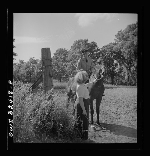 Untitled photo, possibly related to: Oswego, New York. Polish naval officer riding a horse at a farm where the heroes were entertained during United Nations week