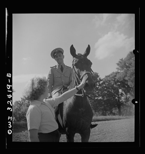Oswego, New York. Polish naval officer riding a horse at a farm where the heroes were entertained during United Nations week