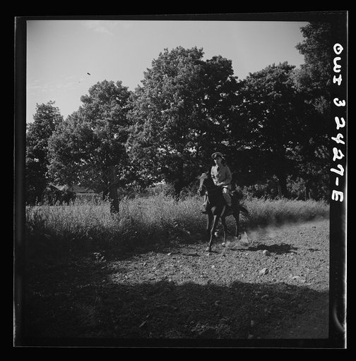 Untitled photo, possibly related to: Oswego, New York. Polish naval officer riding a horse at a farm where the heroes were entertained during United Nations week