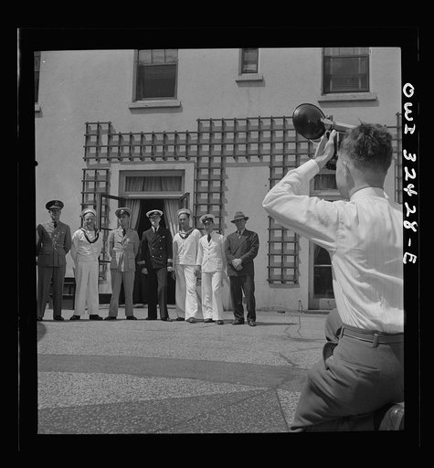 Oswego, New York. Heroes visiting during United Nations week lined up for a photograph by a local newspaper photographer