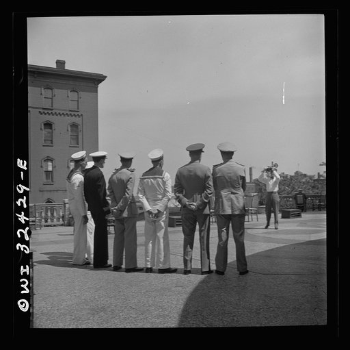 Untitled photo, possibly related to: Oswego, New York. Heroes visiting during United Nations week lined up for a photograph by a local newspaper photographer