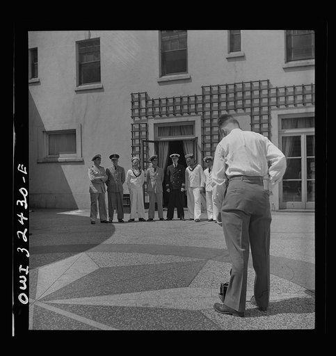Untitled photo, possibly related to: Oswego, New York. Heroes visiting during United Nations week lined up for a photograph by a local newspaper photographer