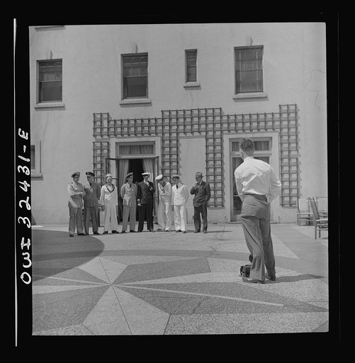 Untitled photo, possibly related to: Oswego, New York. Heroes visiting during United Nations week lined up for a photograph by a local newspaper photographer