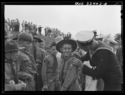 Untitled photo, possibly related to: Oswego, New York. Boy scouts getting autographs from the United Nations heroes on Flag Day during United Nations week