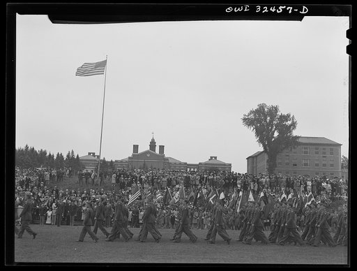 Oswego, New York. Air cadets marching in front of the boy scouts carrying United Nations flags on Flag Day during United Nations week