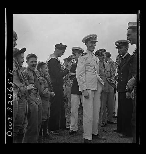 Untitled photo, possibly related to: Oswego, New York. Boy scouts getting autographs from the United Nations heroes on Flag Day during United Nations week