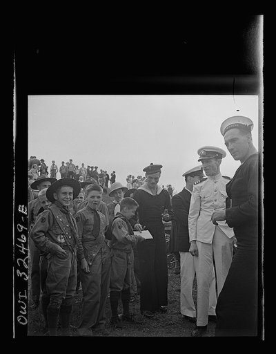 Untitled photo, possibly related to: Oswego, New York. Boy scouts getting autographs from the United Nations heroes on Flag Day during United Nations week