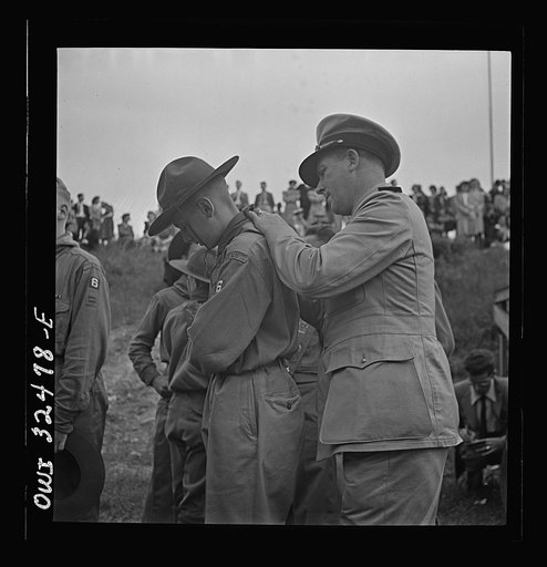 Untitled photo, possibly related to: Oswego, New York. A Norwegian naval officer writing his autograph for a boy scout during United Nations week