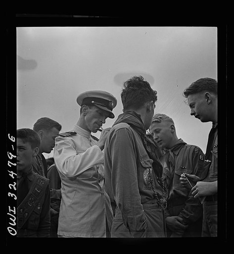 Oswego, New York. A Polish naval officer writing his autograph for a boy scout on Flag Day during United Nations week