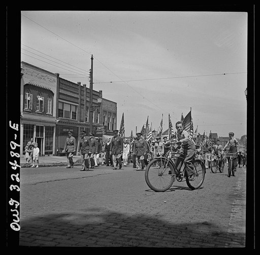 Untitled photo, possibly related to: Oswego, New York. United Nations heroes marching in the Flag Day parade during United Nations week