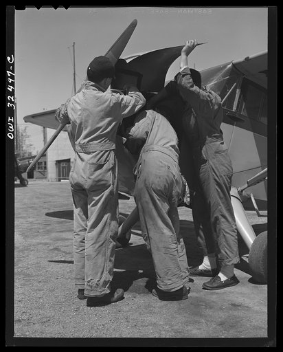 Untitled photo, possibly related to: Bar Harbor, Maine. Civil Air Patrol base headquarters of coastal patrol no. 20. Pilots and observers talking things over
