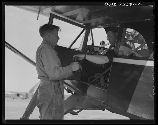 Untitled photo, possibly related to: Bar Harbor, Maine. Civil Air Patrol base headquarters of coastal patrol no. 20. Pilot signing out before taking off for patrol