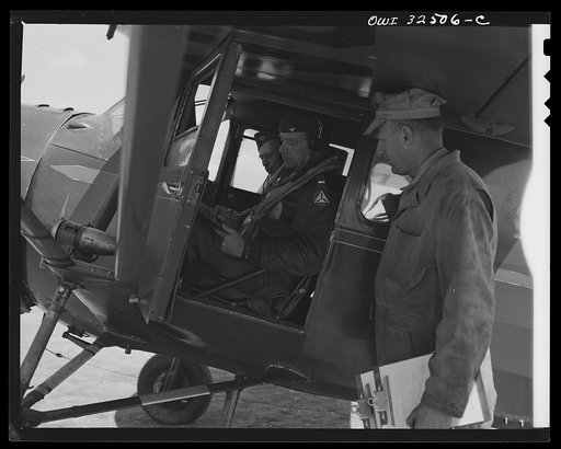 Bar Harbor, Maine. Civil Air Patrol base headquarters of coastal patrol no. 20. Pilot signing out before taking off for patrol