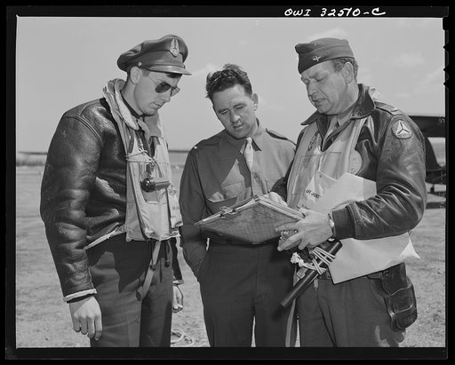 Bar Harbor, Maine. Civil Air Patrol base headquarters of coastal patrol no. 20. Pilots checking their patrol with an intelligence officer