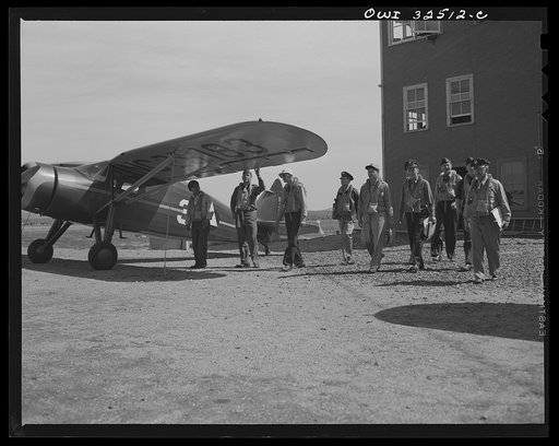 Untitled photo, possibly related to: Bar Harbor, Maine. Civil Air Patrol base headquarters of coastal patrol no. 20. Dusk patrol leaving the intelligence room to go to their planes
