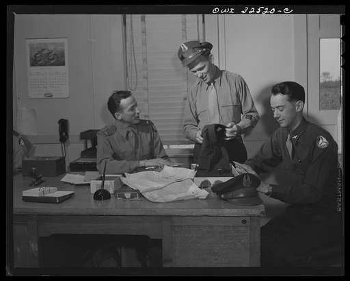 Bar Harbor, Maine. Civil Air Patrol base headquarters of coastal patrol no. 20. Flyers purchasing uniforms in the administration office