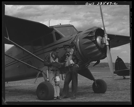 Bar Harbor, Maine. Civil Air Patrol base headquarters of Coastal Patrol Number. A pilot and an observer waiting to take off for patrol
