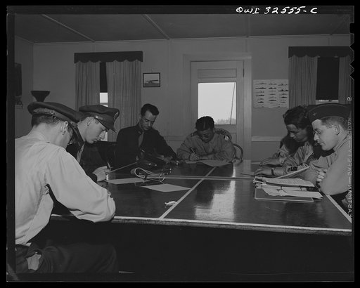 Untitled photo, possibly related to: Bar Harbor, Maine. Civil Air Patrol base headquarters of coastal patrol no. 20. Classes in shipping identification and patrol technique are held each morning in the pilots' lounge