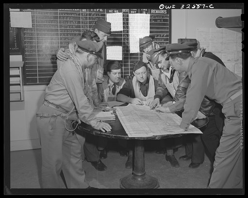Untitled photo, possibly related to: Bar Harbor, Maine. Civil Air Patrol base headquarters of coastal patrol no. 20. Dawn patrol flyers and observers making routine reports before starting on patrol