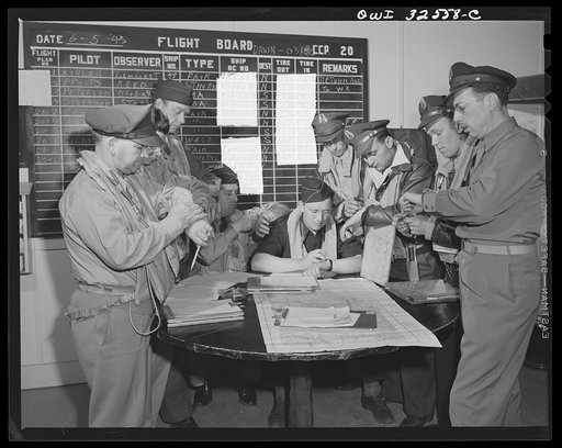 Untitled photo, possibly related to: Bar Harbor, Maine. Civil Air Patrol base headquarters of coastal patrol no. 20. Dawn patrol flyers and observers making routine reports before starting on patrol