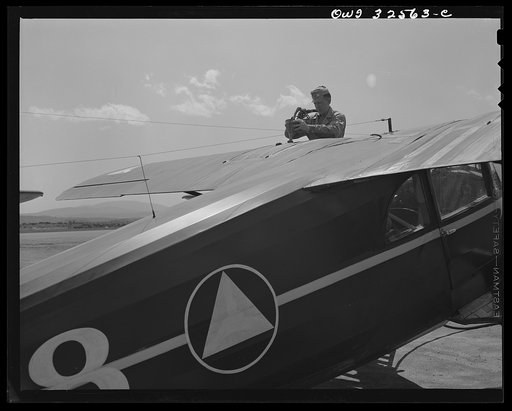 Bar Harbor, Maine. Civil Air Patrol base headquarters of coastal patrol no. 20. Gassing a plane