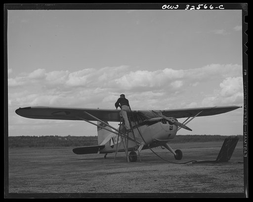 Untitled photo, possibly related to: Bar Harbor, Maine. Civil Air Patrol base headquarters of coastal patrol no. 20. Gassing a plane