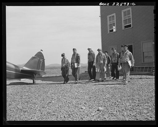 Untitled photo, possibly related to: Bar Harbor, Maine. Civil Air Patrol base headquarters of coastal patrol no. 20. Dusk patrol leaving the intelligence room to go to their planes
