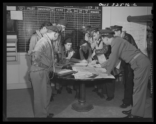 Untitled photo, possibly related to: Bar Harbor, Maine. Civil Air Patrol base headquarters of coastal patrol no. 20. Dawn patrol flyers and observers making routine reports before starting on patrol