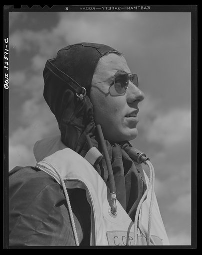 Untitled photo, possibly related to: Bar Harbor, Maine. Civil Air Patrol base headquarters of coastal patrol no. 20. Eric "Dutch" Lammert, a pilot in a rubber waterproof crash suit, works throughout the winter months