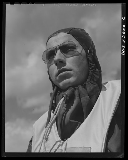 Bar Harbor, Maine. Civil Air Patrol base headquarters of coastal patrol no. 20. Eric "Dutch" Lammert, a pilot in a rubber waterproof crash suit, works throughout the winter months