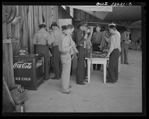 Untitled photo, possibly related to: Bar Harbor, Maine. Civil Air Patrol base headquarters of coastal patrol no. 20. Routine inspection of "Mae Wests," life-preserving vests worn by flyers on all patrols over water