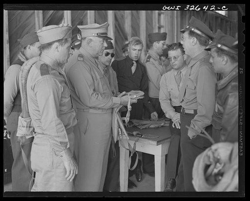 Bar Harbor, Maine. Civil Air Patrol base headquarters of coastal patrol no. 20. Major J.B. King, base commander, inspecting "Mae West" life preservers