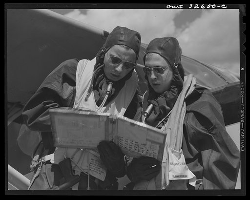 Bar Harbor, Maine. Civil Air Patrol base headquarters of coastal patrol no. 20. A pilot and an observer dressed in rubber crash suits worn by fliers throughout the winter months