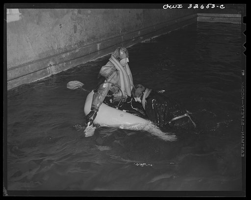 Bar Harbor, Maine. Civil Air Patrol base headquarters of coastal patrol no. 20. Testing a rubber crash boat in the swimming pool